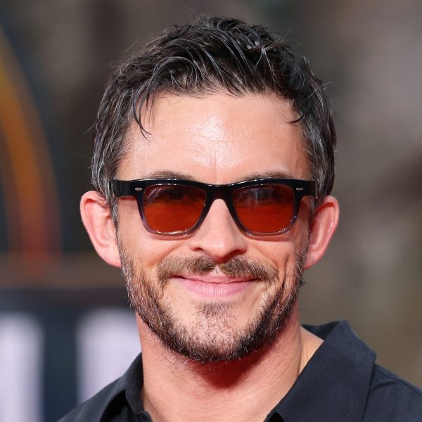 Jonathan Bailey’s Hair: Swept Back Wet Look Hairstyle